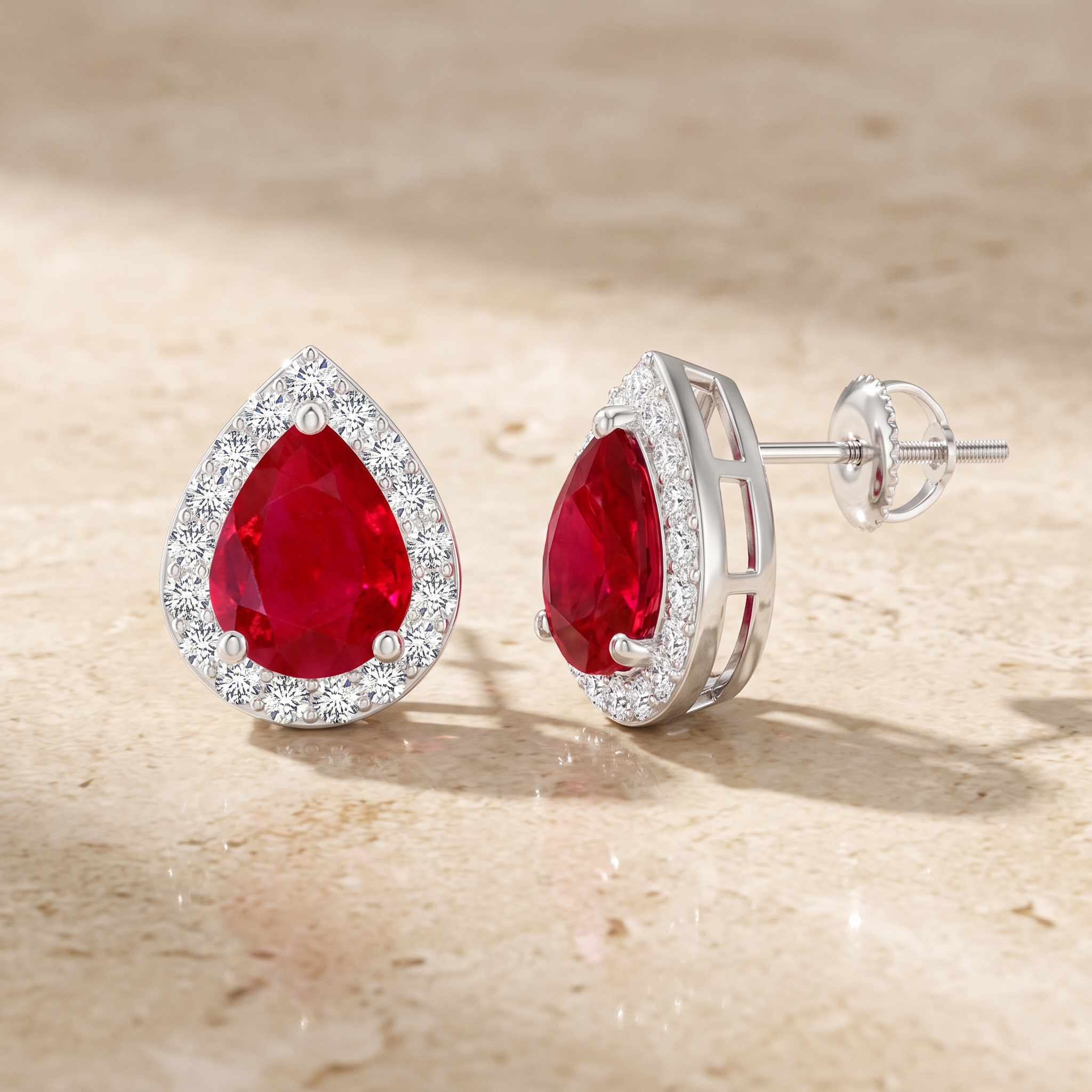 Pear-Shaped Ruby Halo Stud Earrings by Angara